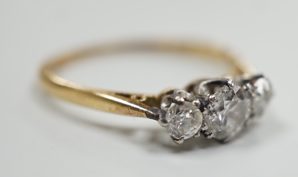 An 18ct and three stone diamond set ring, size, T/U, gross weight 2.9 grams
